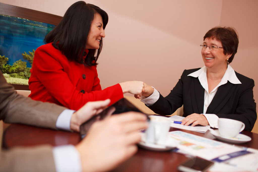 Salesperson shaking hands with a client